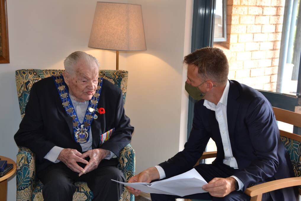 MEMORIES: Bob Porteous recalls his time during the Second World War as a navigator to Mayor Rhys Williams. Photo: Sophia Holl.