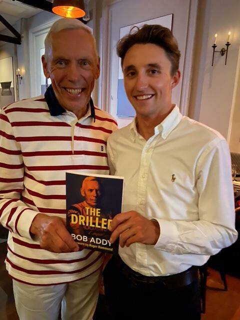 Bob Addy recently presented 2022 Giro d'Italia winner Perth's Jai Hindley a copy of The Driller. He also donated 100 copies to help fundraising efforts to send young cyclists to Europe. Picture supplied. 