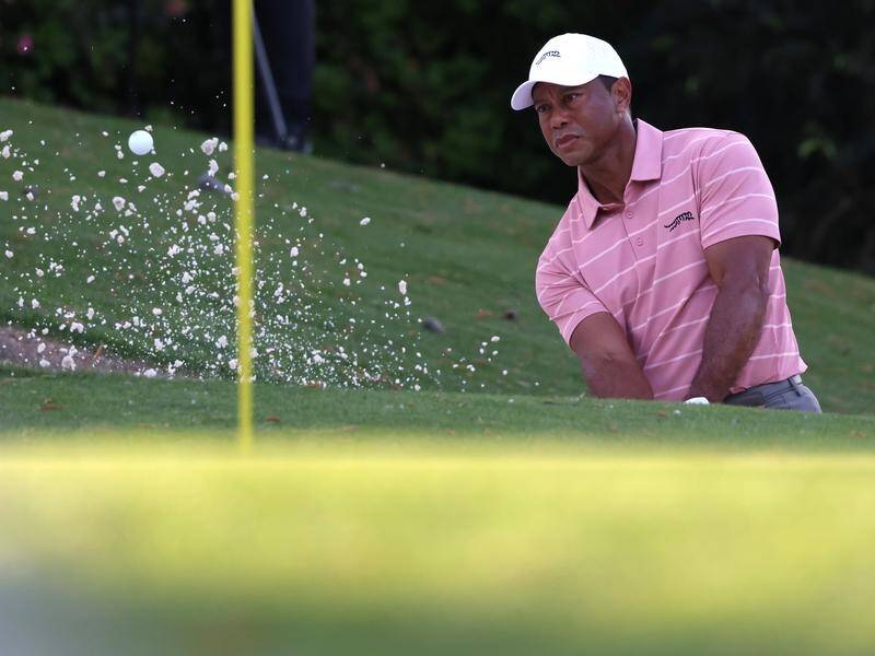 Tiger defies aches, pains, poor light on Masters quest Mandurah Mail